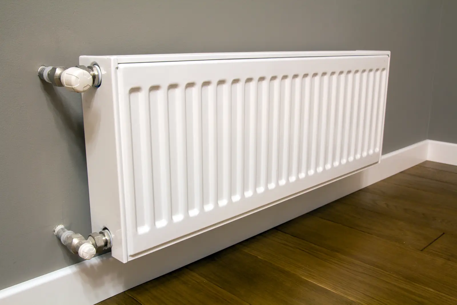 Modern radiator with a thermostatic valve in Egham